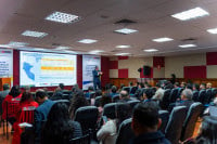 Oscar Guzman speaks at the EIP semiannual meeting in Peru