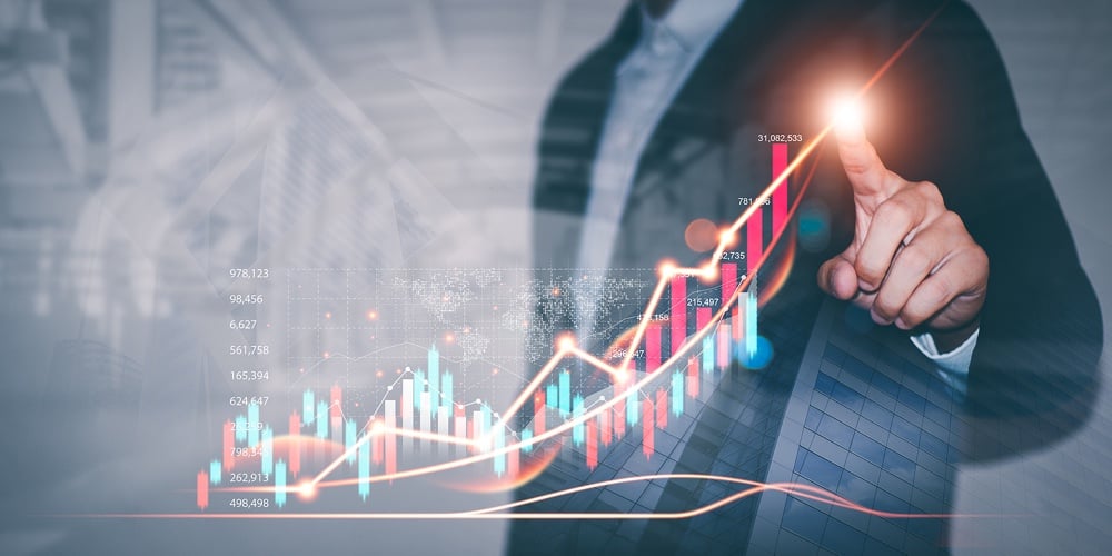 Businessman Draws Graphs Of Business Growth And Analyzes Financial And Investment Data